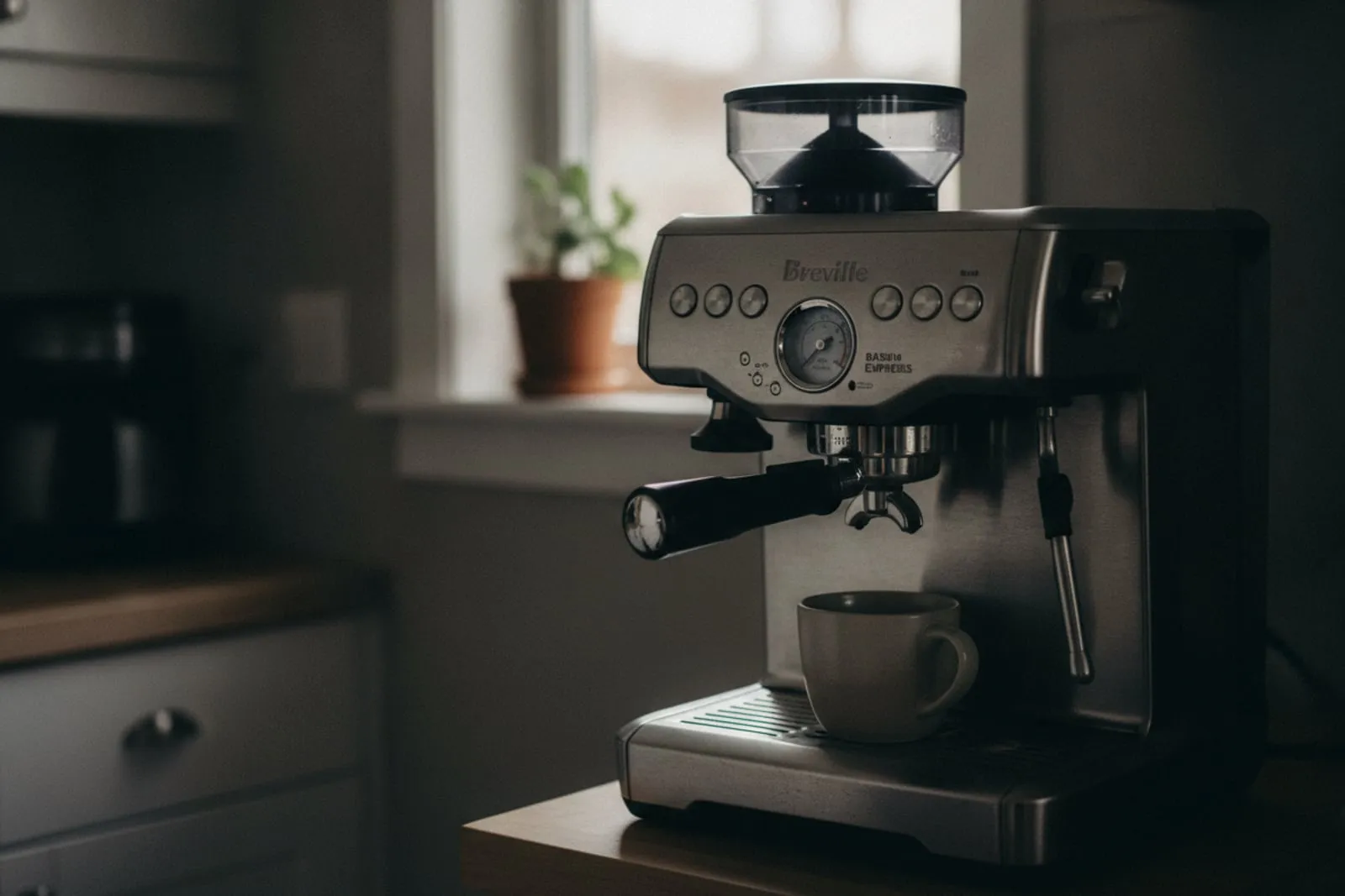 Breville Barista Express alone on a kitchen counter, portafilter locked in, cup under the group